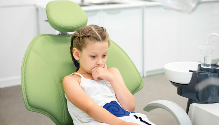 child in dental chair 