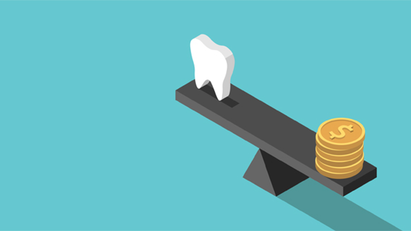 tooth and coin on seesaw
