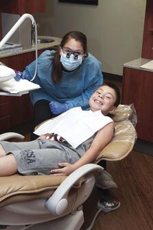 Hygienist with young male patient