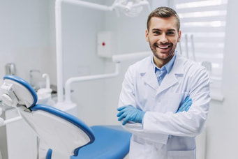 Dentist standing in operatory