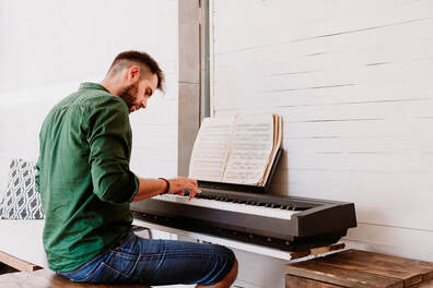 Man Playing on Piano 