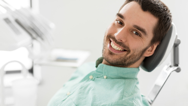dental patient smiling in operatory chair
