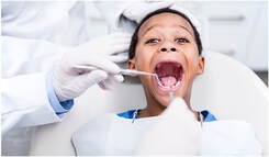 Kid getting a dental check