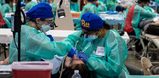 Pitt Dental Assistants working on patient