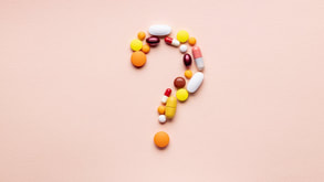 pills in shape of a question mark 