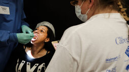 Woman getting oral examination 