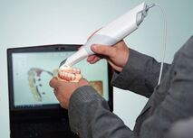 dental professional using an intraoral scanner