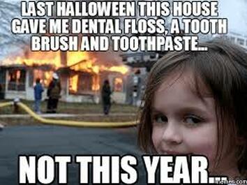Picture of a house burning down - the dentist who gives out toothbrushes at halloween.