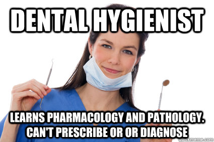 Picture of dental hygienist holding instruments.